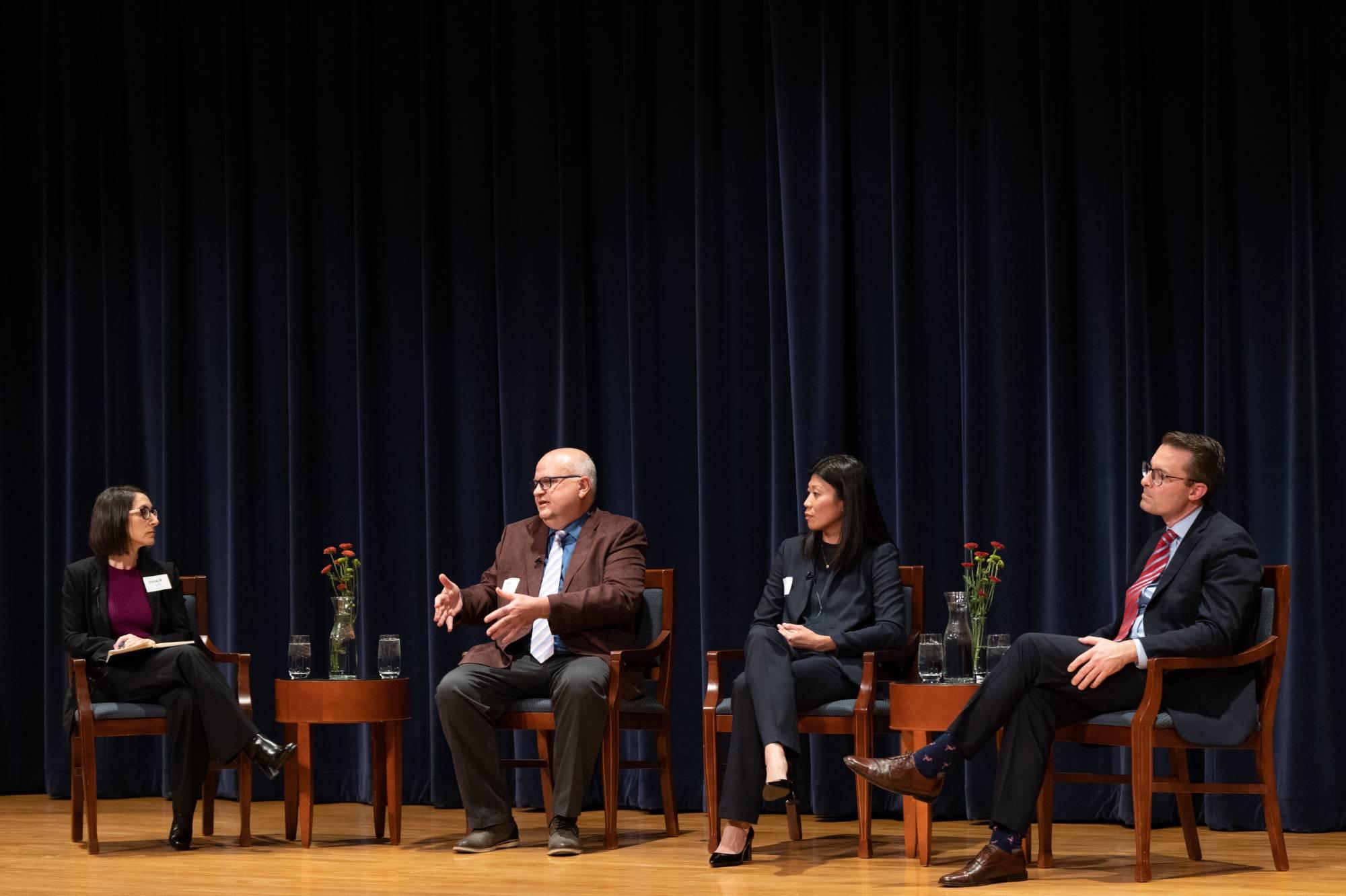 people speaking on a panel